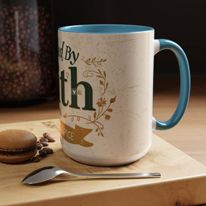 Lifestyle photo of 15oz light blue “Fueled by Faith & Pumpkin Spice” mug — large Christian fall mug styled beside macarons and coffee beans.