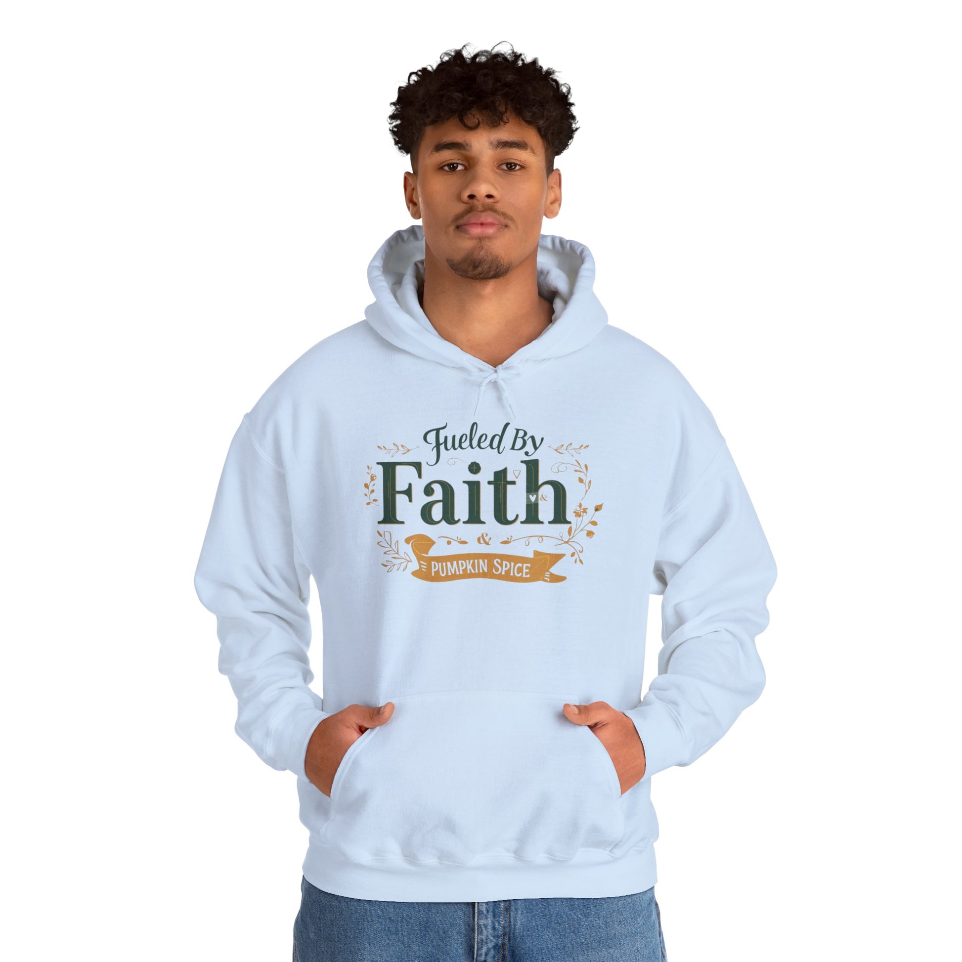 Man wearing light blue “Fueled by Faith & Pumpkin Spice” hoodie — unisex Christian hoodie perfect for the fall season.