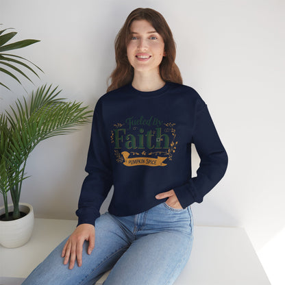 Woman sitting indoors in navy “Fueled by Faith & Pumpkin Spice” sweatshirt — cozy Christian fall fashion lifestyle photo.