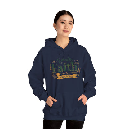 Woman modeling navy “Fueled by Faith & Pumpkin Spice” hoodie — cozy unisex Christian hoodie with faith-inspired fall message.