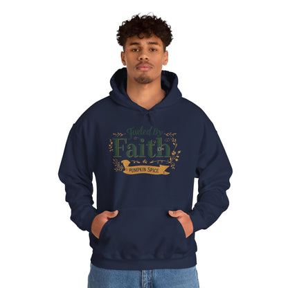 Man wearing navy “Fueled by Faith & Pumpkin Spice” hoodie — stylish Christian hoodie perfect for fall coffee moments.