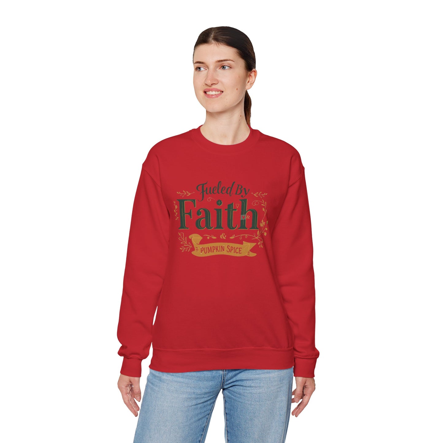 Woman modeling red “Fueled by Faith & Pumpkin Spice” sweatshirt — comfortable unisex faith-based apparel for autumn.
