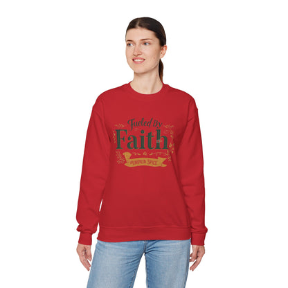 Woman modeling red “Fueled by Faith & Pumpkin Spice” sweatshirt — comfortable unisex faith-based apparel for autumn.