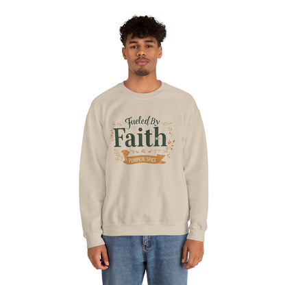 Man wearing sand “Fueled by Faith & Pumpkin Spice” crewneck sweatshirt — unisex Christian fall fashion with minimalist design.