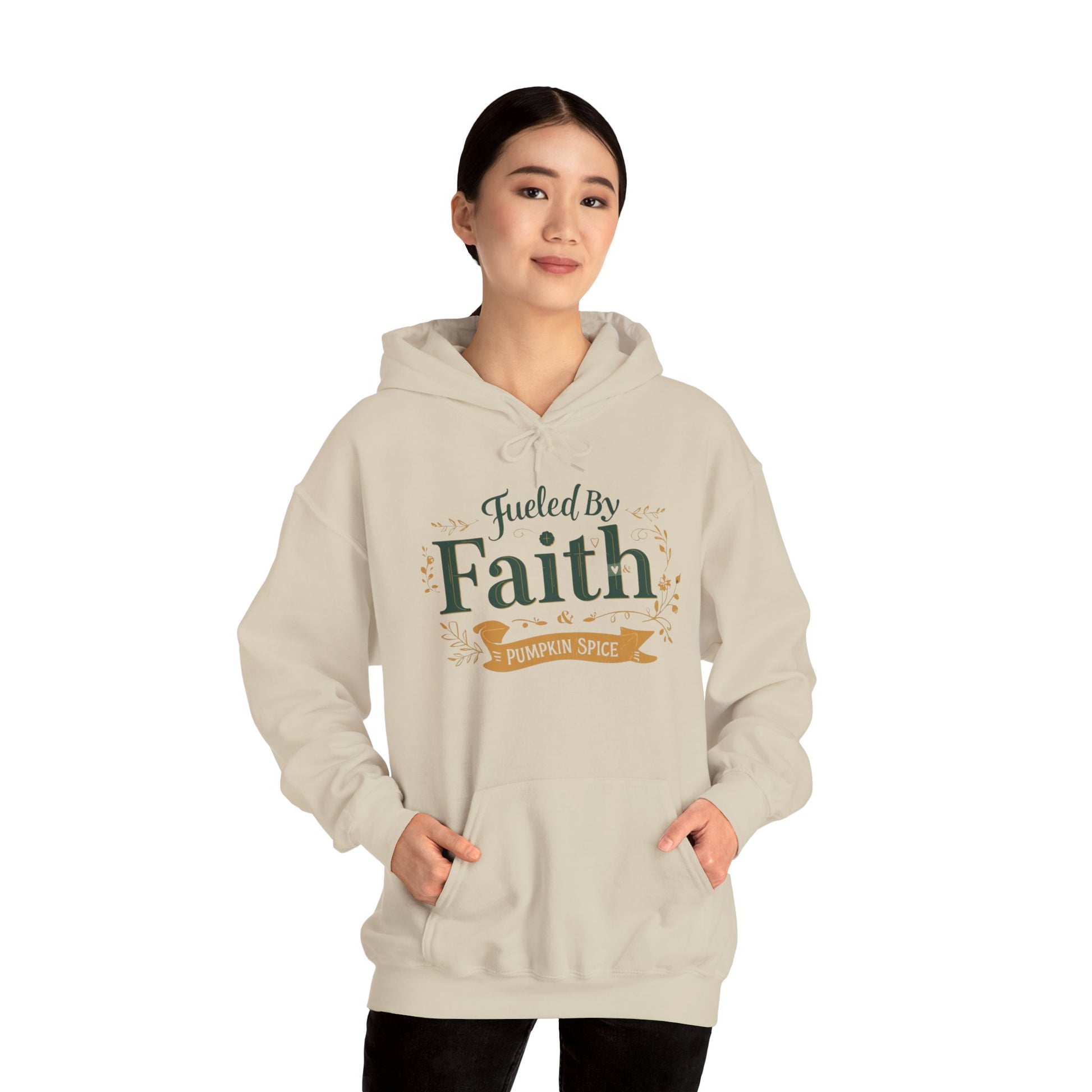 Woman wearing sand “Fueled by Faith & Pumpkin Spice” hoodie — unisex neutral Christian fall hoodie for cozy days.