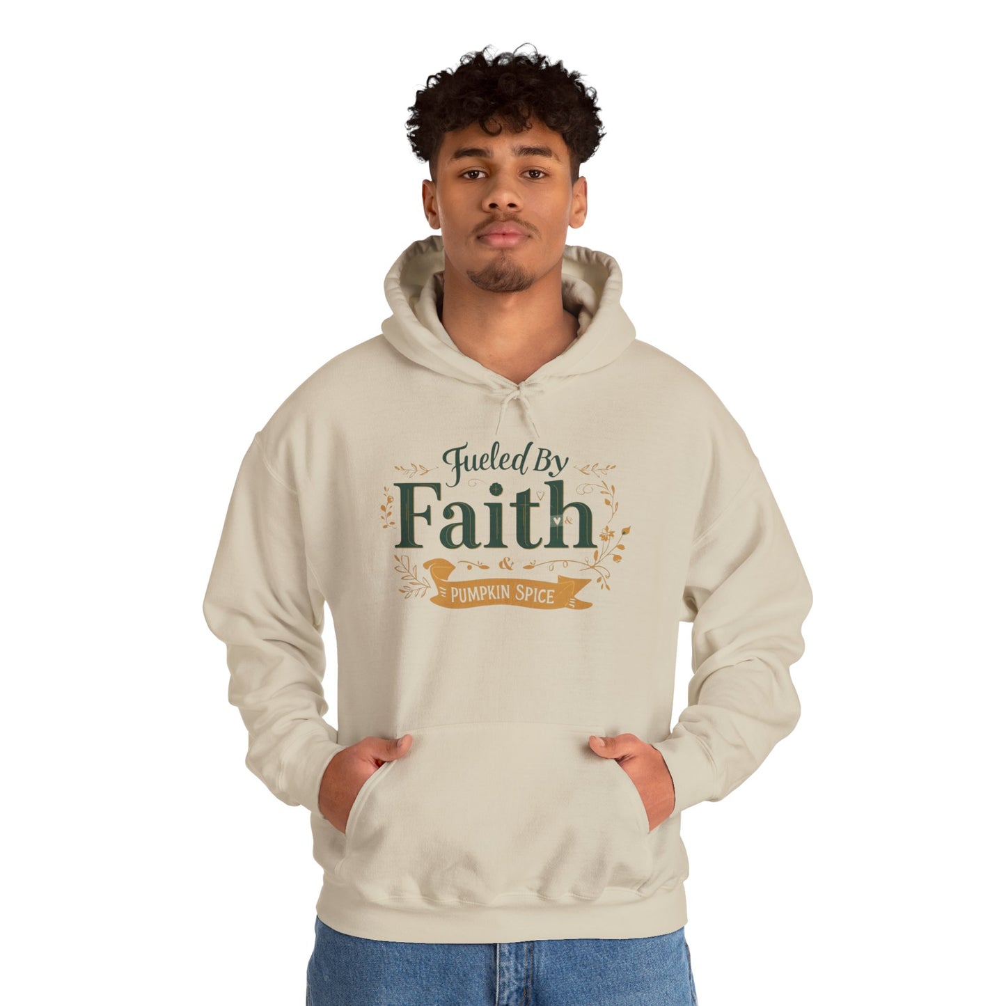 Man wearing sand “Fueled by Faith & Pumpkin Spice” hoodie — comfortable faith-inspired fall sweatshirt for believers.