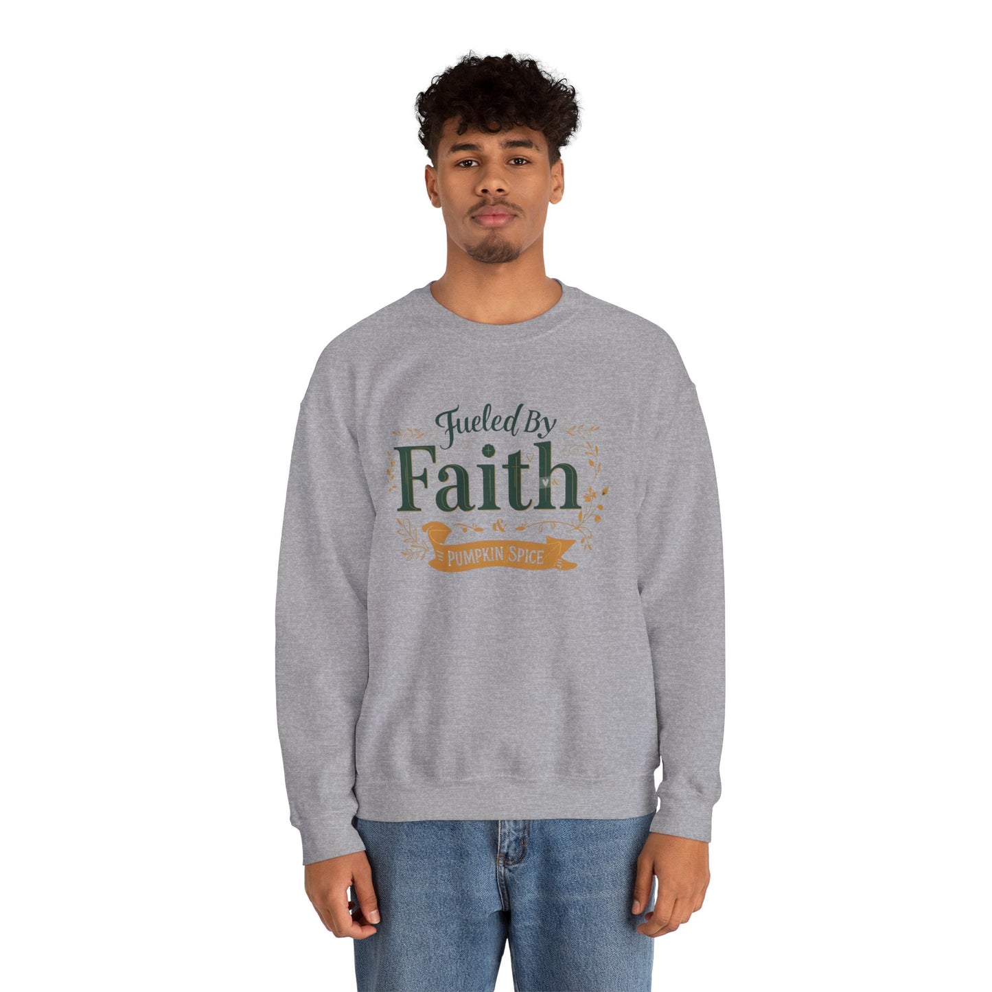 Man wearing sport grey “Fueled by Faith & Pumpkin Spice” crewneck sweatshirt — casual unisex Christian fall outfit for faith-filled style.