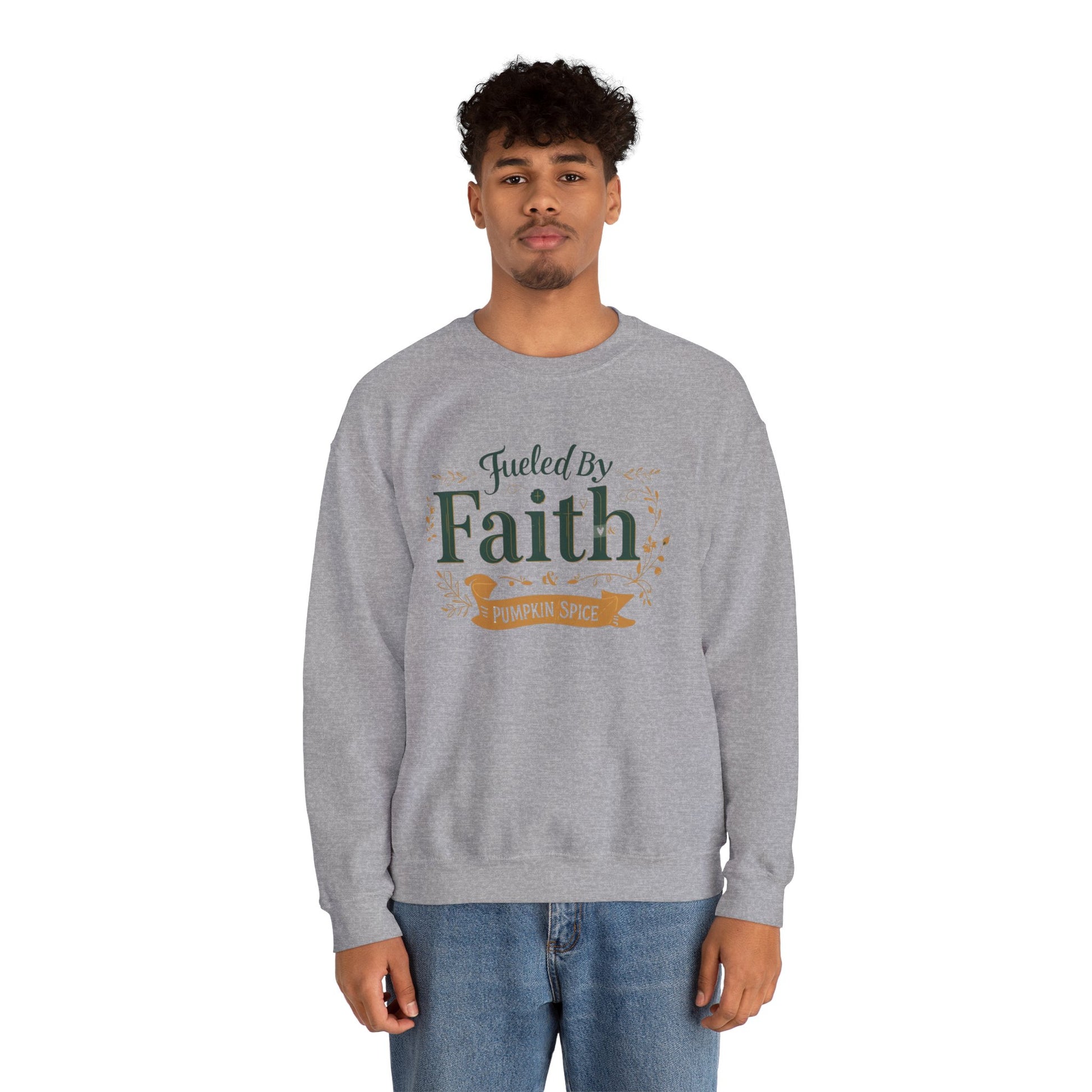 Man wearing sport grey “Fueled by Faith & Pumpkin Spice” crewneck sweatshirt — casual unisex Christian fall outfit for faith-filled style.