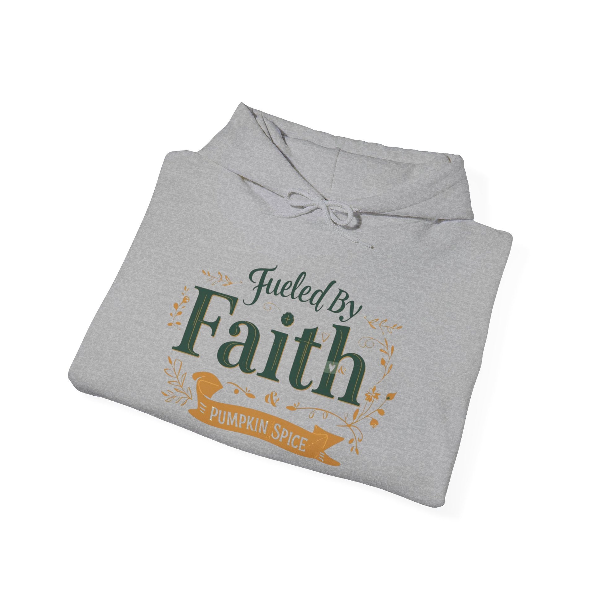 Folded sport grey “Fueled by Faith & Pumpkin Spice” hoodie — unisex Christian fall hoodie with green and gold lettering.