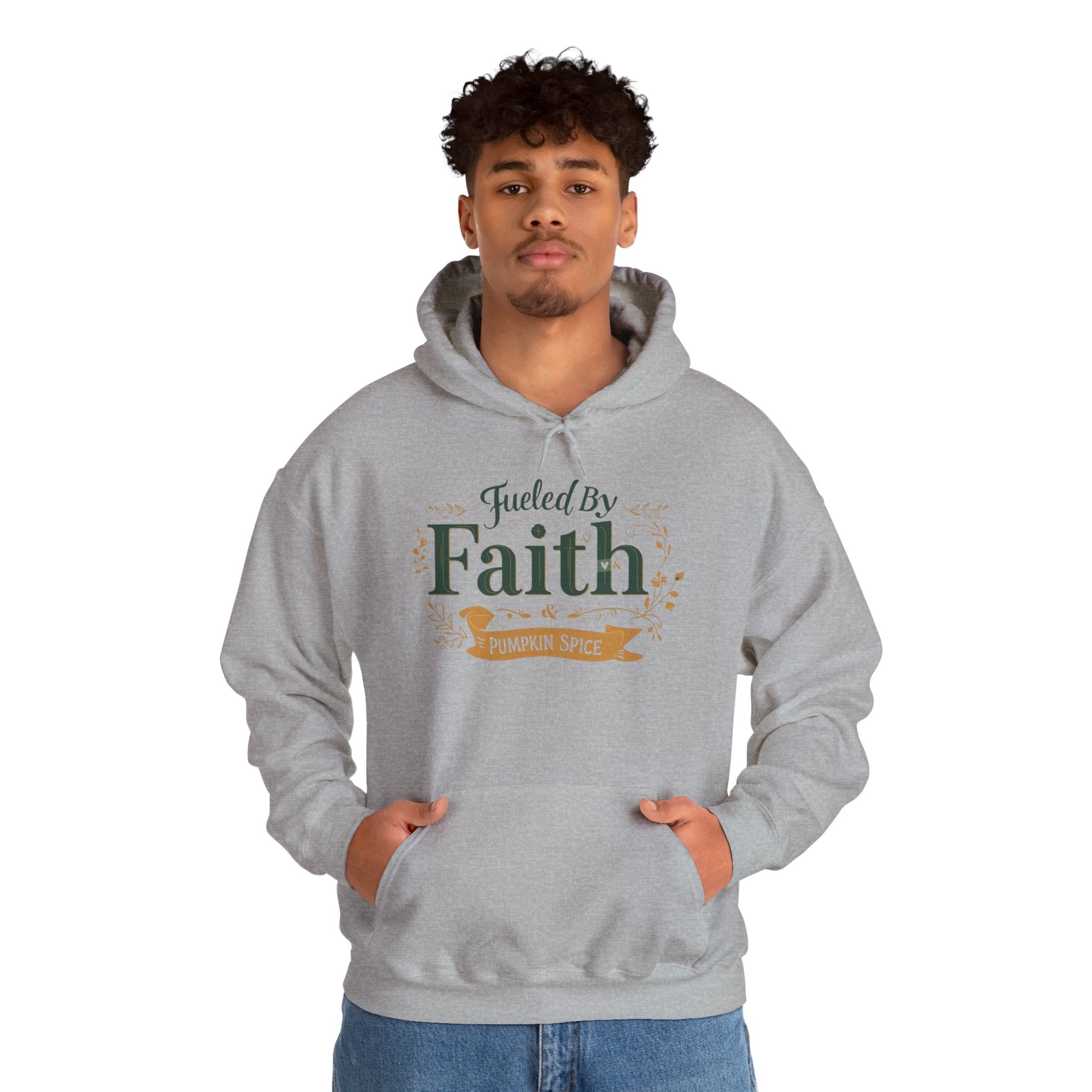 Man wearing sport grey “Fueled by Faith & Pumpkin Spice” hoodie — faith-inspired unisex hoodie for fall season style.