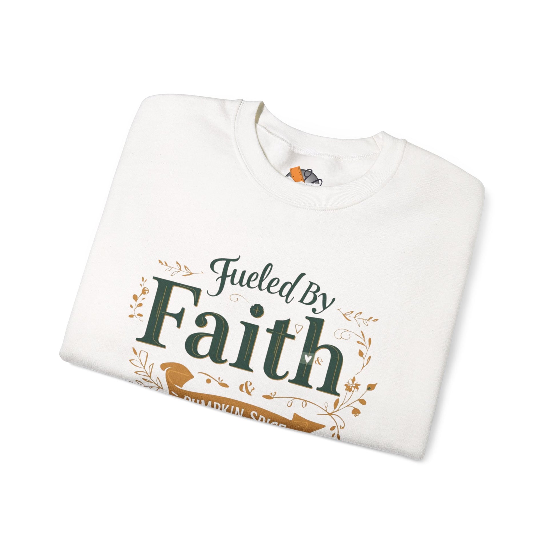 Folded white “Fueled by Faith & Pumpkin Spice” sweatshirt — cozy Christian fall apparel with faith-inspired typography.