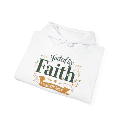 Folded white “Fueled by Faith & Pumpkin Spice” hoodie — cozy Christian hoodie with gold and green faith design, perfect for fall lovers.