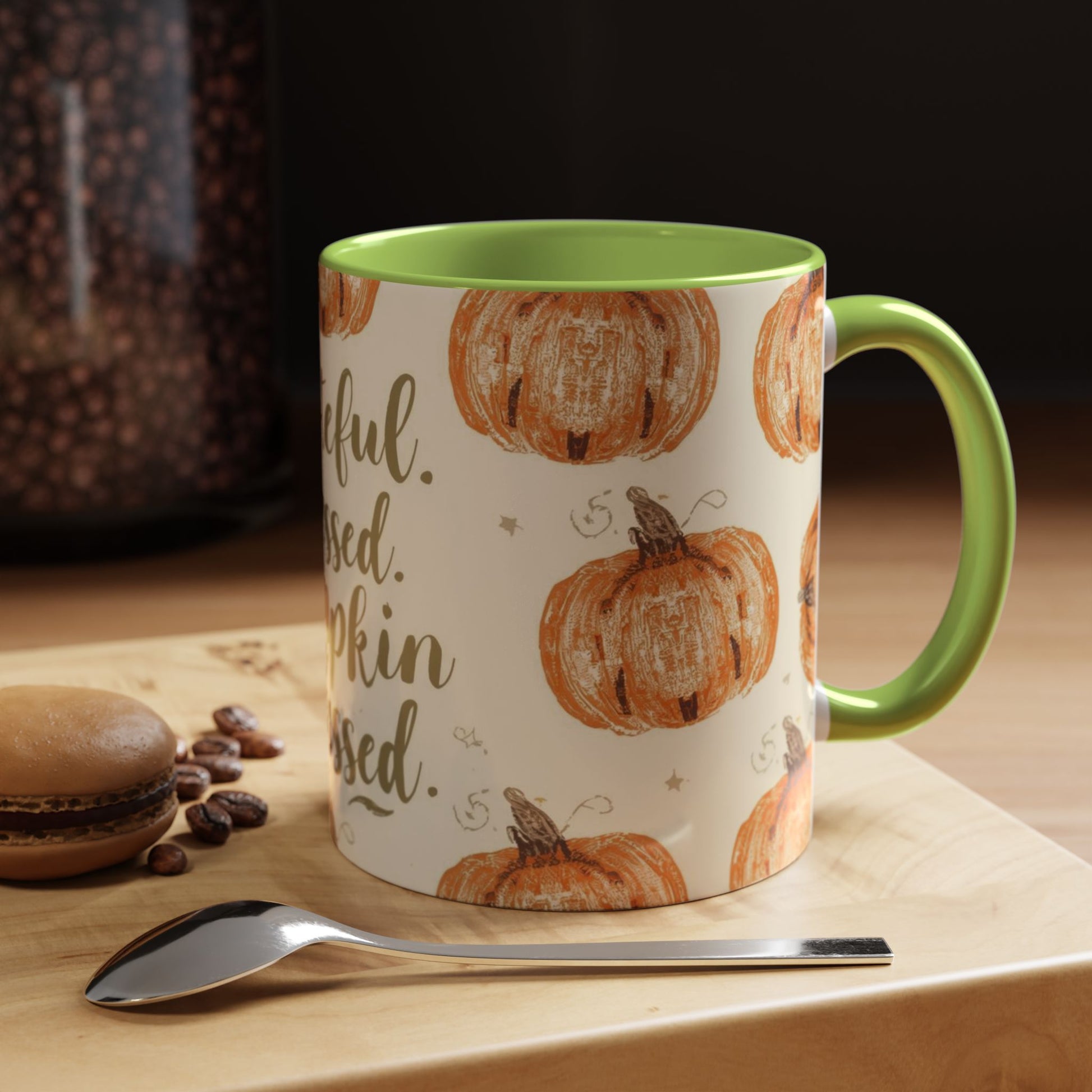 Grateful, Blessed & Pumpkin Obsessed green accent mug styled on cozy fall table with coffee beans and dessert for autumn mornings.