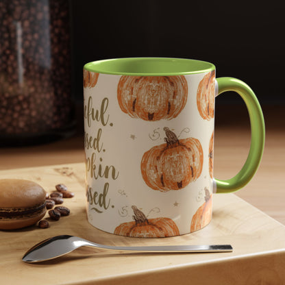Grateful, Blessed & Pumpkin Obsessed green accent mug styled on cozy fall table with coffee beans and dessert for autumn mornings.