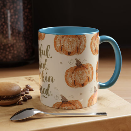 Grateful, Blessed & Pumpkin Obsessed light blue accent mug on cozy fall table — autumn coffee setup with dessert, beans, and warm morning light.