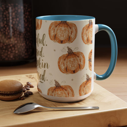 Grateful, Blessed & Pumpkin Obsessed light blue accent mug on wooden coffee bar with macaron and coffee beans — cozy fall kitchen decor.