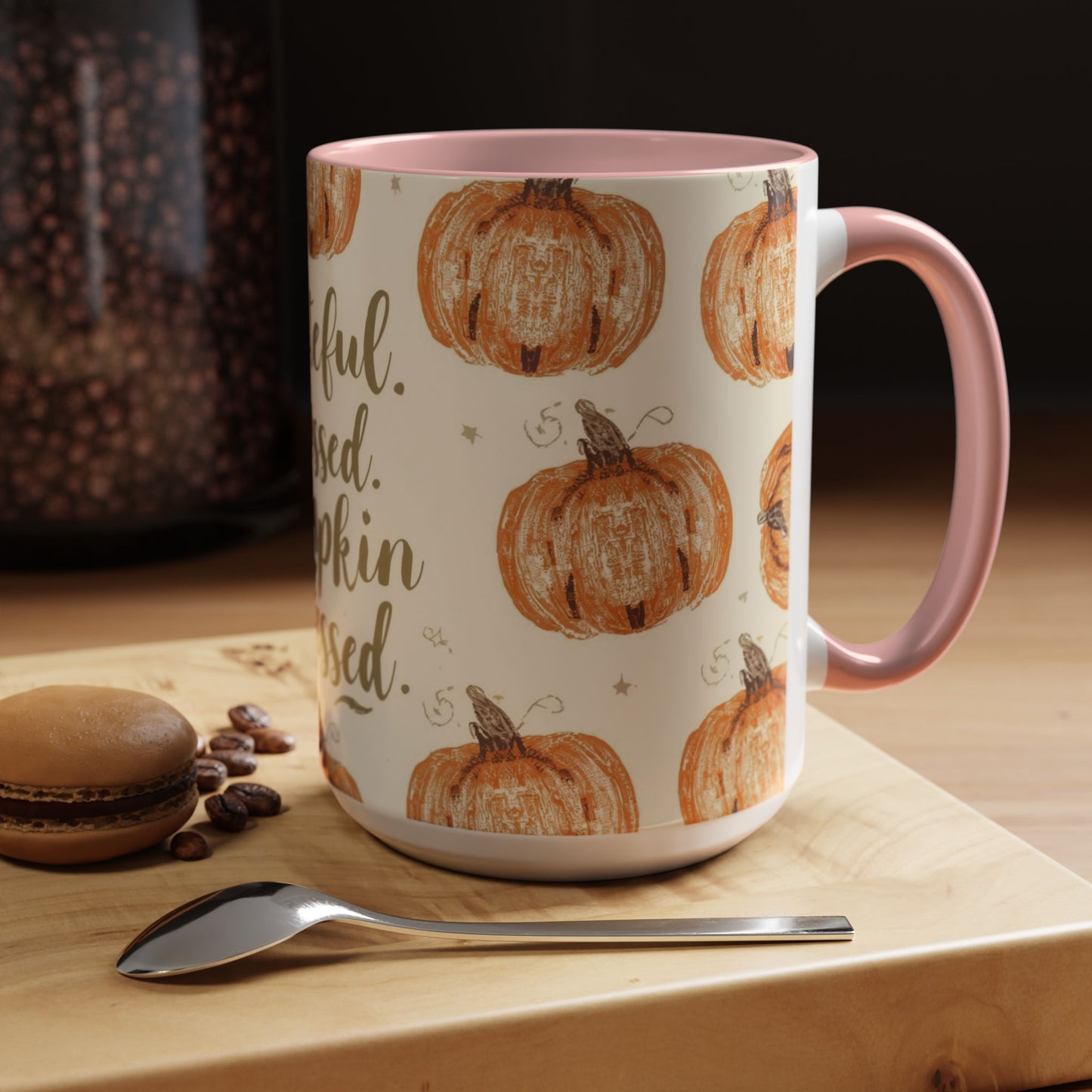 Grateful, Blessed & Pumpkin Obsessed light pink accent mug styled on wooden table — cozy autumn coffee setup with dessert and coffee beans.