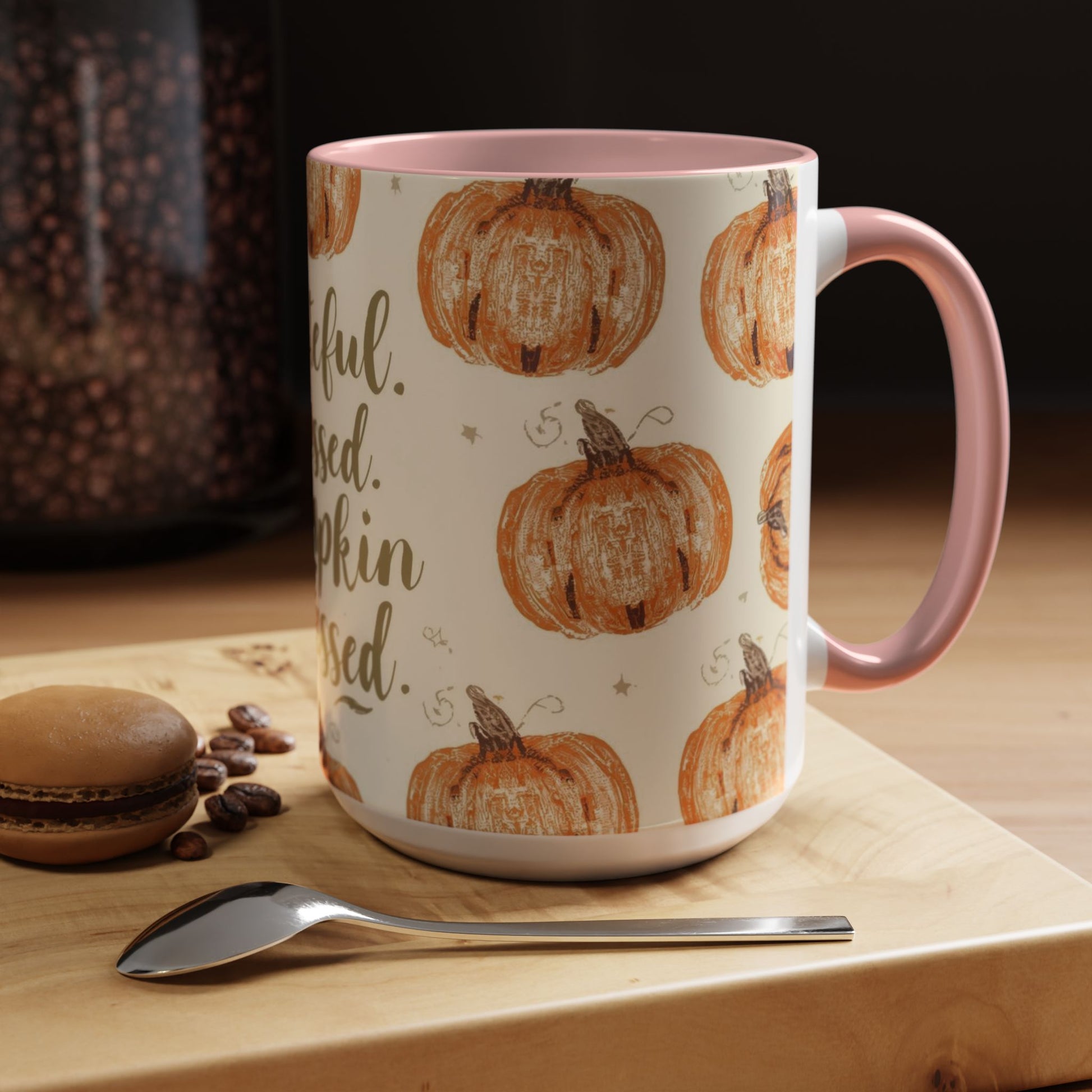 Grateful, Blessed & Pumpkin Obsessed light pink accent mug styled on wooden table — cozy autumn coffee setup with dessert and coffee beans.