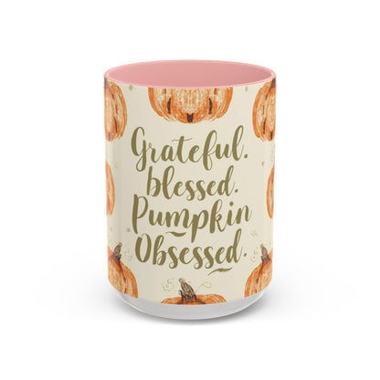Grateful, Blessed & Pumpkin Obsessed 15oz light pink accent mug — autumn-themed coffee cup with pumpkin design and pastel pink interior.