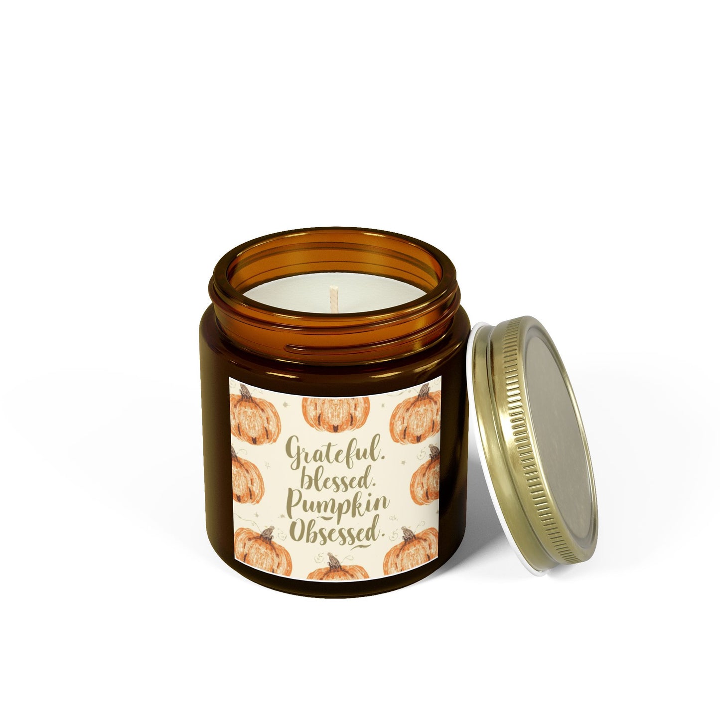 Amber glass “Grateful, Blessed & Pumpkin Obsessed” 4 oz candle with gold lid — rich blackberry vanilla scented candle with cozy pumpkin fall label.