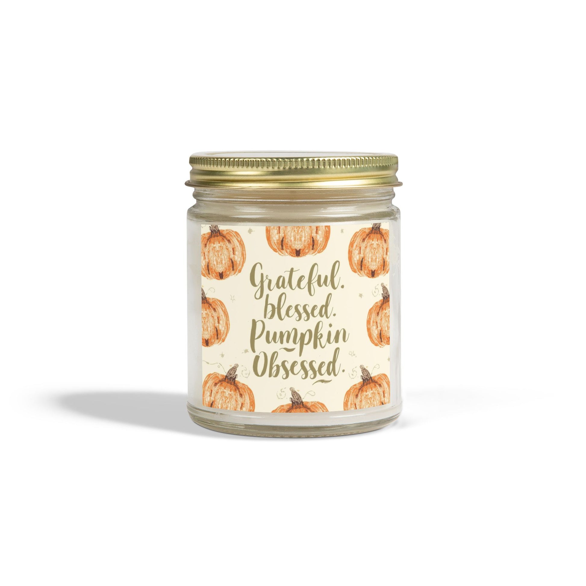 Clear glass “Grateful, Blessed & Pumpkin Obsessed” 9oz candle with gold lid — cozy pumpkin-themed fall candle with cashmere musk fragrance.