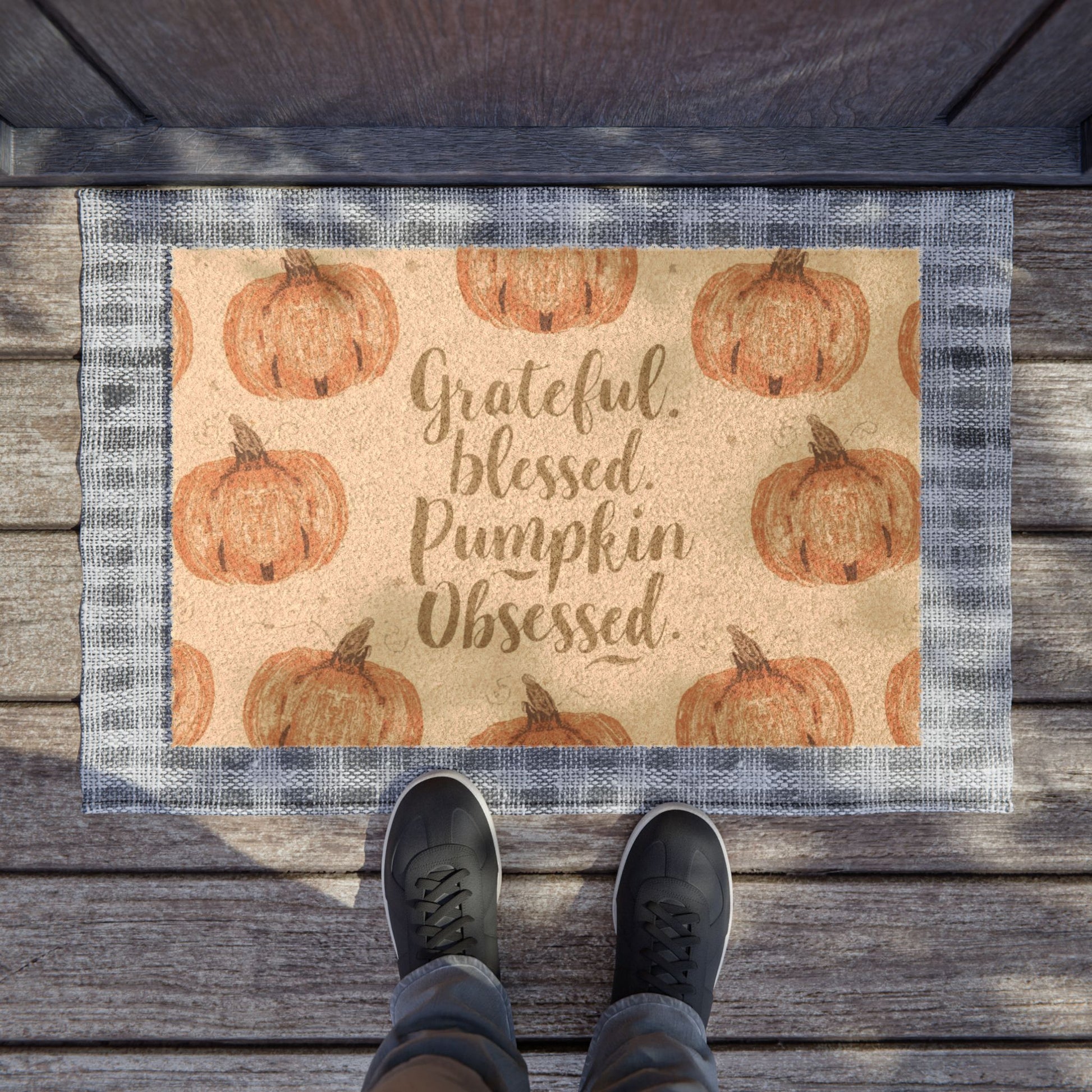 “Grateful, Blessed & Pumpkin Obsessed” pumpkin doormat styled on front porch — layered fall welcome mat for farmhouse or cozy home decor.