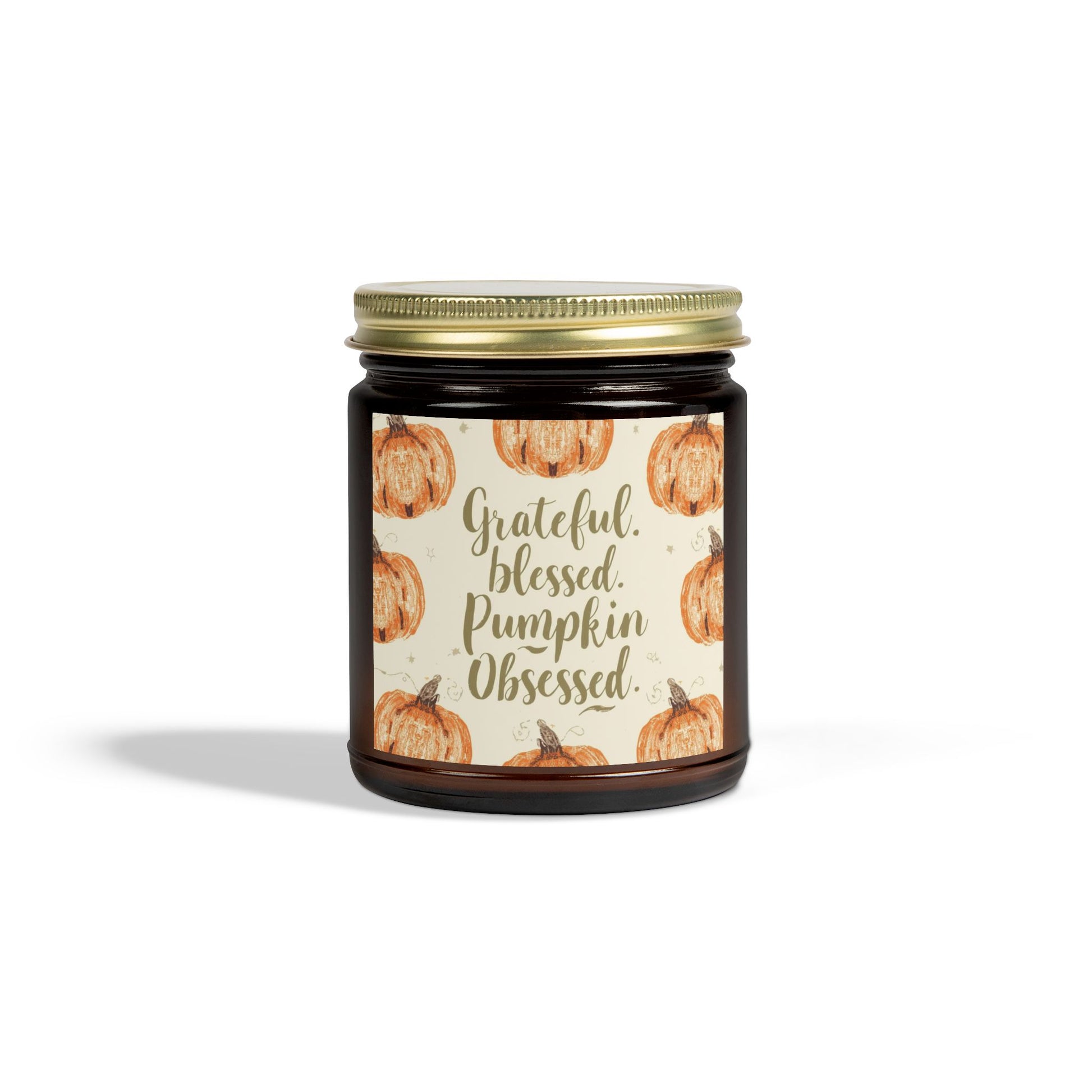 Amber glass “Grateful, Blessed & Pumpkin Obsessed” 9oz candle with gold lid — cozy pumpkin candle with fresh Fraser Fir scent, perfect for winter and fall home decor.