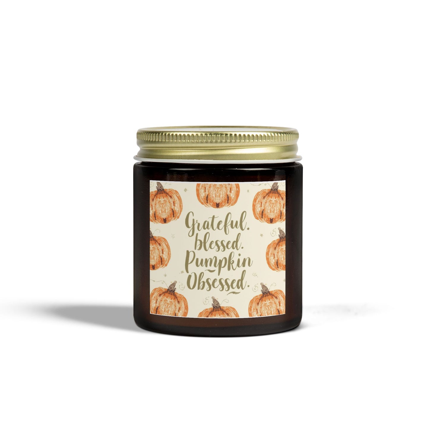Amber glass “Grateful, Blessed & Pumpkin Obsessed” 4 oz candle with gold lid — soothing lavender-scented candle featuring cozy fall pumpkin design.