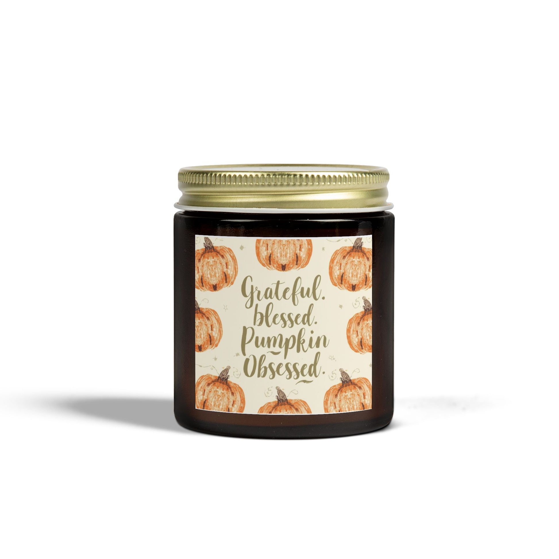 Amber glass “Grateful, Blessed & Pumpkin Obsessed” 4 oz candle with gold lid — elegant unscented soy candle featuring cozy fall pumpkin design.