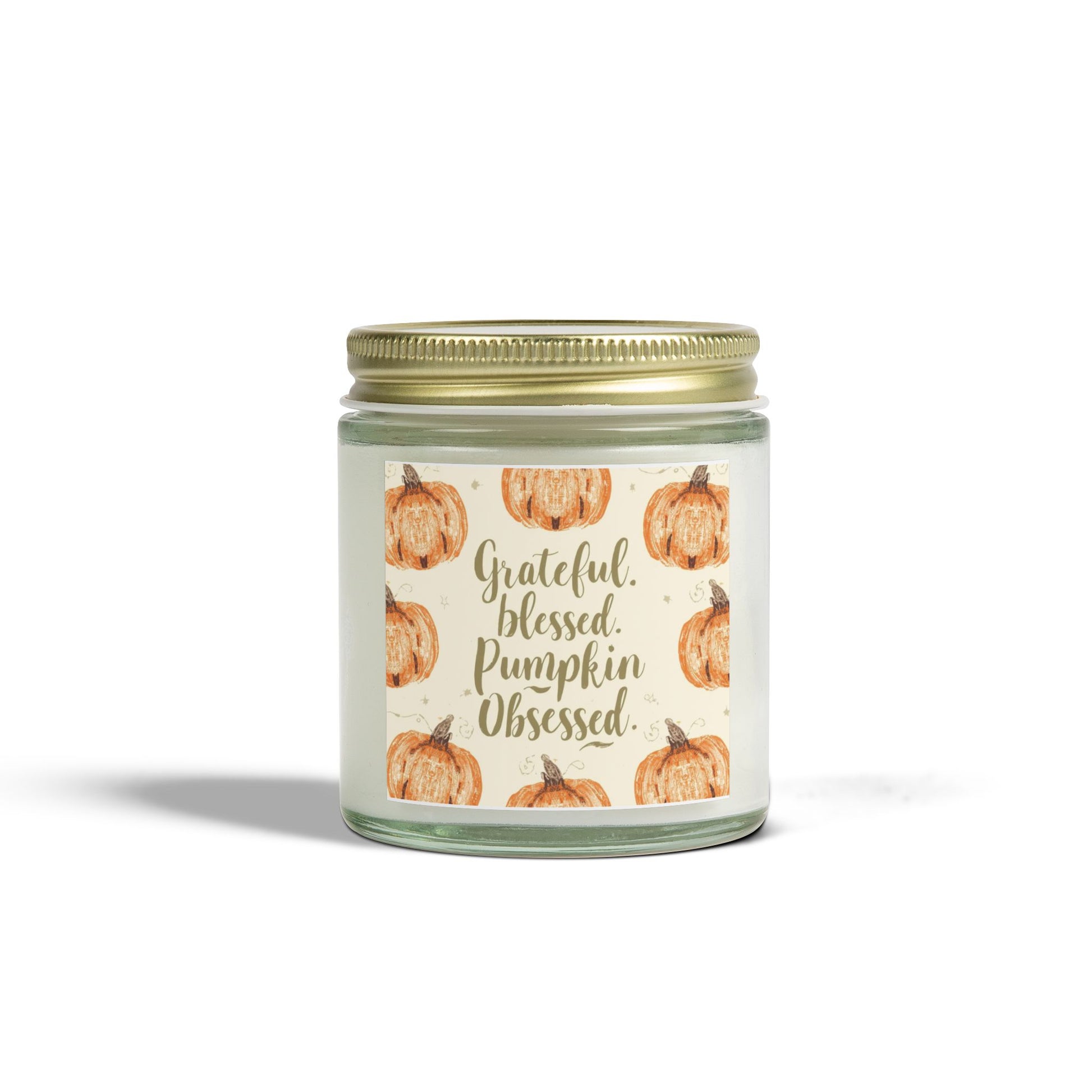 Clear glass “Grateful, Blessed & Pumpkin Obsessed” 4 oz candle with gold lid — creamy vanilla bean scented soy candle with pumpkin design.