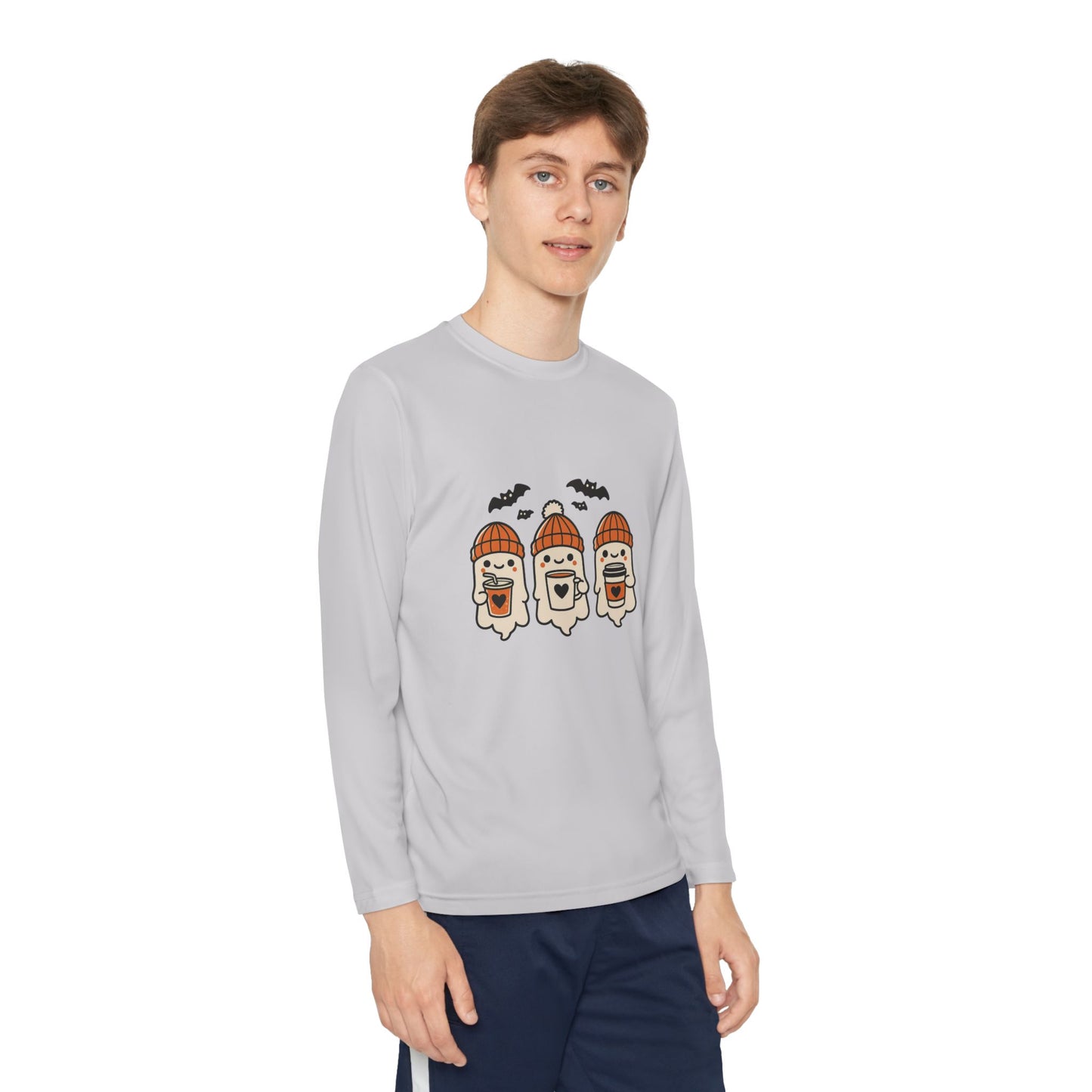 young Man in silver Halloween long sleeve shirt with ghost trio graphic, cozy fall design by Makin’ It By Lady Ev.