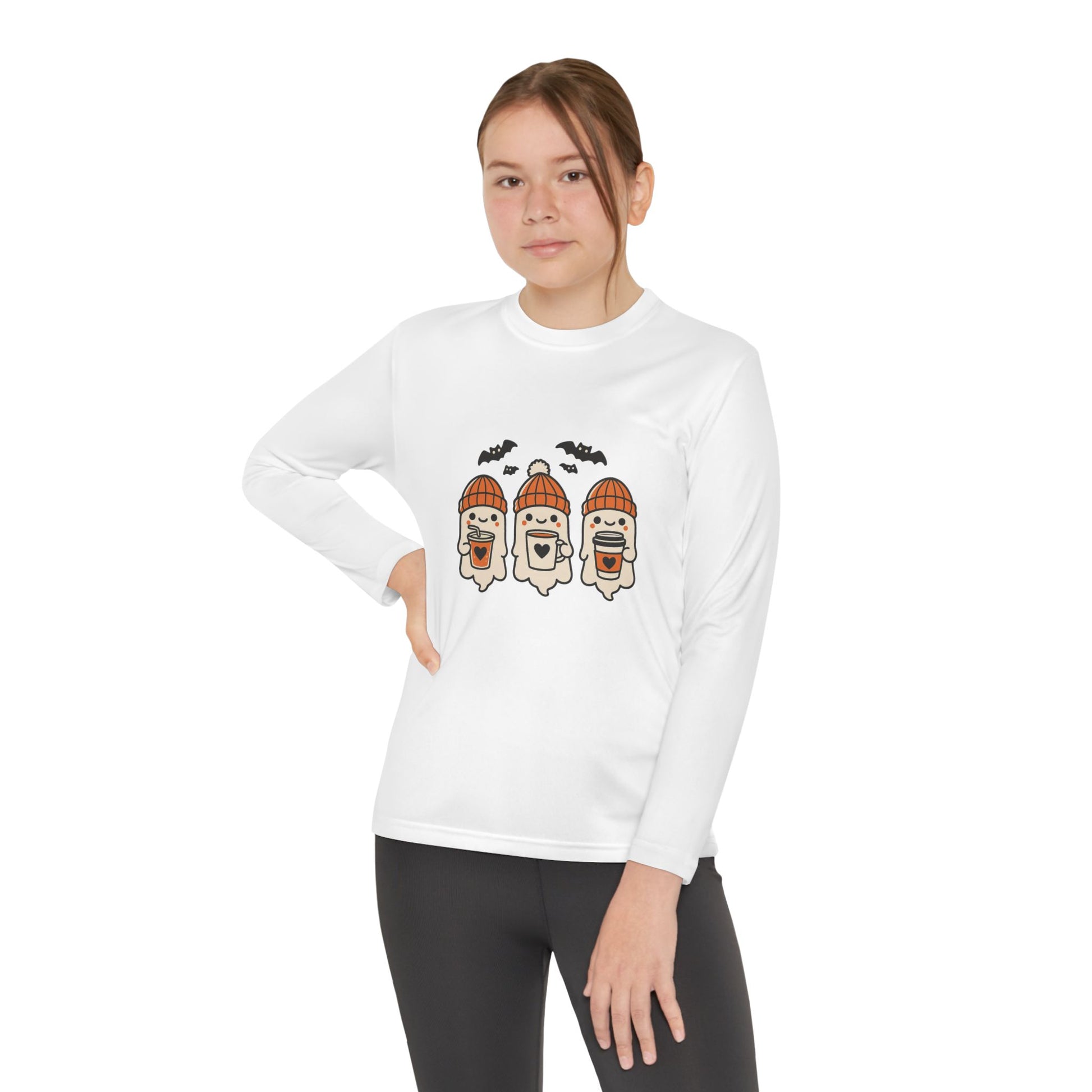 youth/young Woman modeling white Halloween ghost long sleeve shirt, cozy fall design by Makin’ It By Lady Ev.
