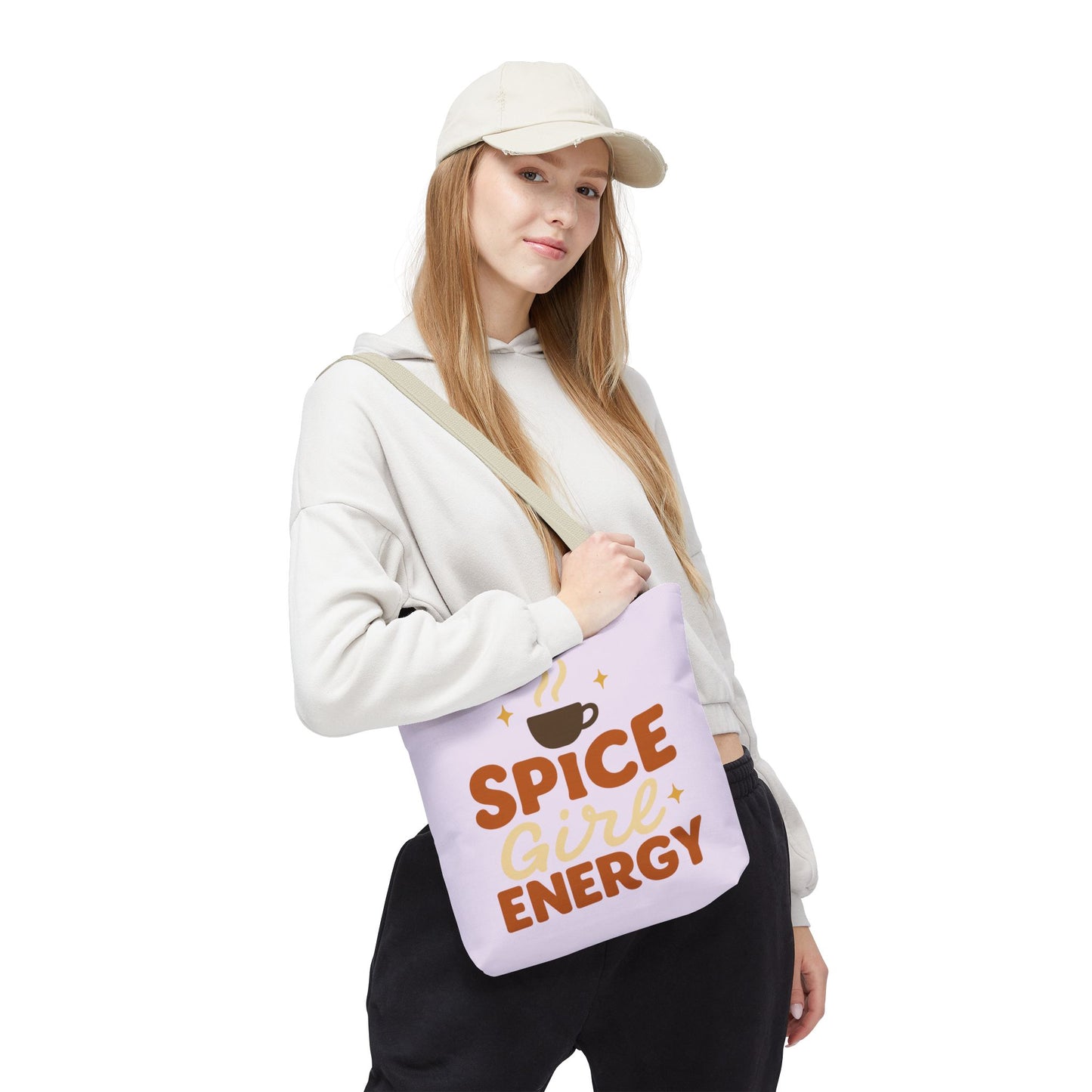 Woman wearing lilac “Spice Girl Energy” tote bag with beige handles — stylish pastel tote for coffee lovers and cozy everyday outings.