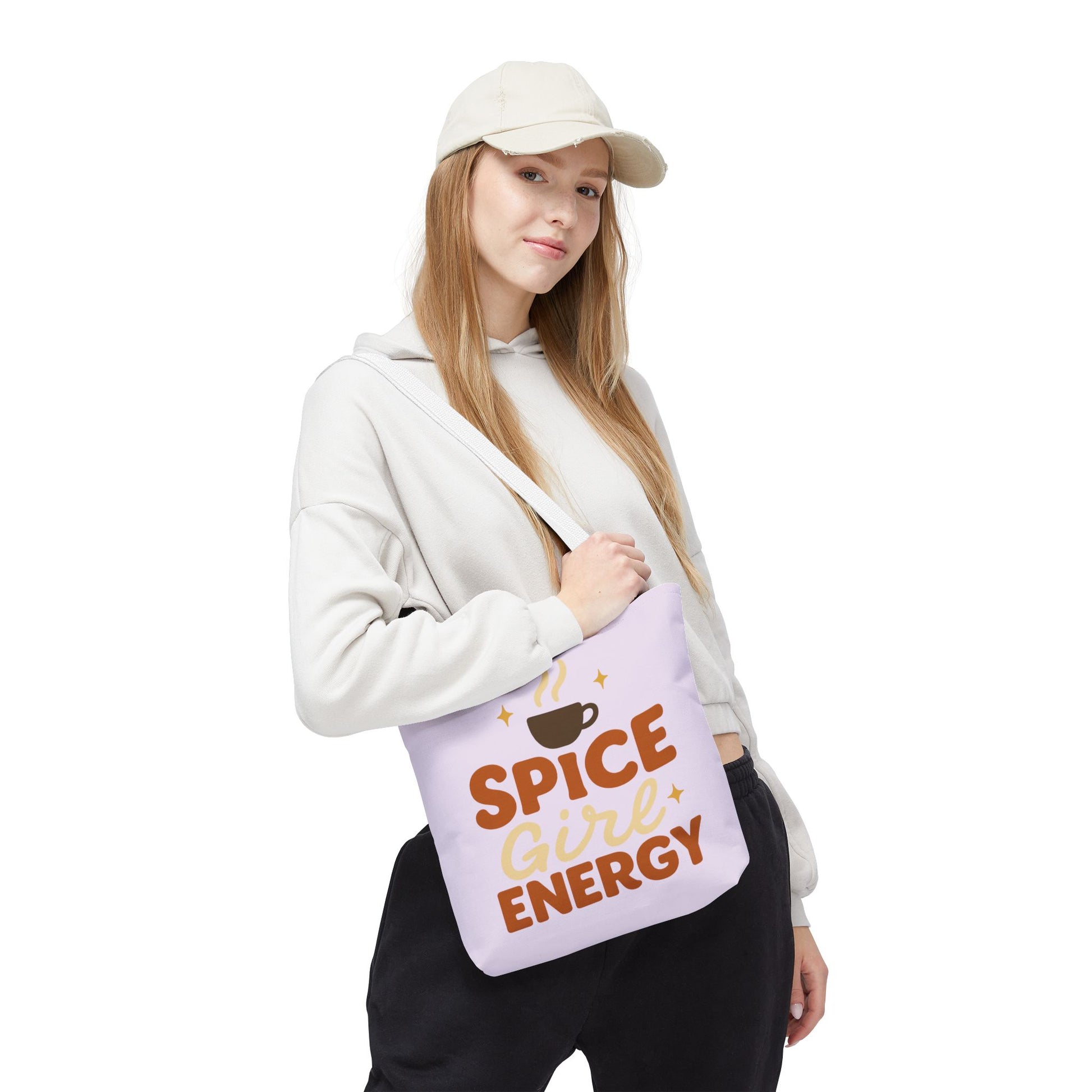 Model wearing lilac “Spice Girl Energy” tote bag with white handles — trendy pastel tote bag for coffee lovers and cozy fashion.