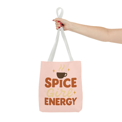 White-handled pale pink “Spice Girl Energy” tote bag held in hand — feminine coffee-inspired tote for fall outfits and daily adventures.