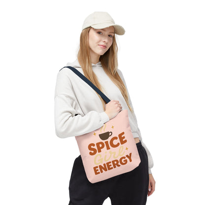 Model carrying pale pink “Spice Girl Energy” tote bag with navy handles — cute fall tote for coffee enthusiasts and everyday style.