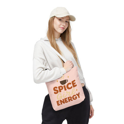 Model carrying pale pink “Spice Girl Energy” tote bag with white handles — pastel coffee tote for cozy days and autumn fashion.