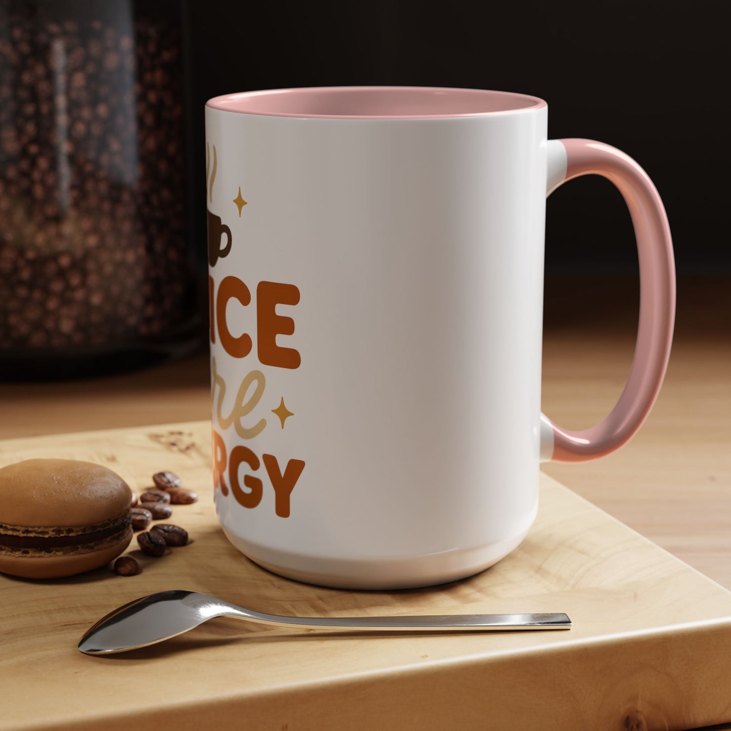 Pink “Spice Girl Energy” accent mug on wooden coffee table — white ceramic 15 oz mug with pink interior beside coffee beans and macaron for a warm fall aesthetic.