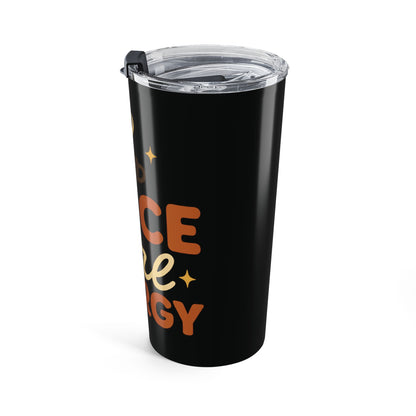 Side view of “Spice Girl Energy” black tumbler highlighting warm orange and cream lettering design.