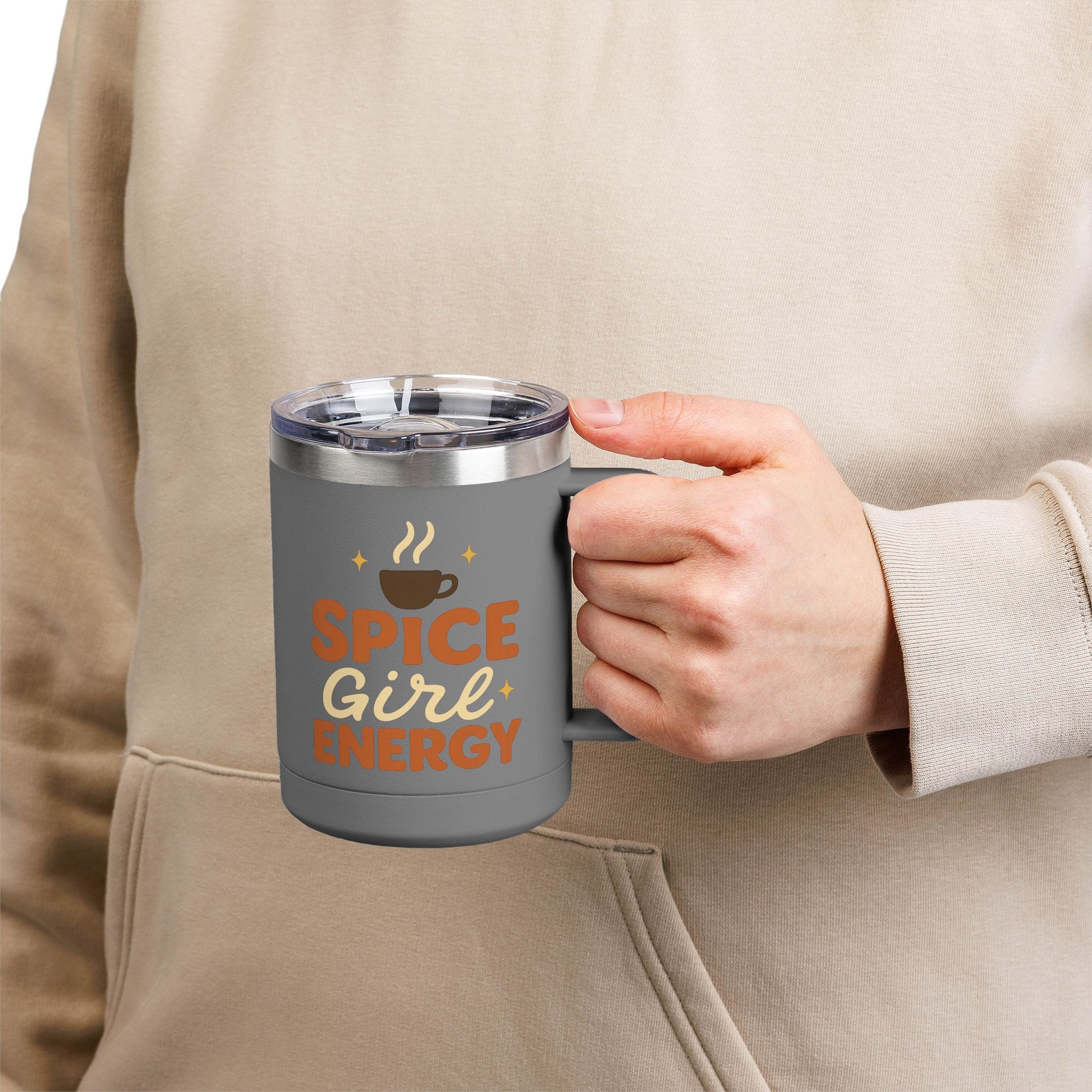Person holding dark gray “Spice Girl Energy” insulated mug — chic stainless steel coffee mug for fall mornings and cozy vibes.