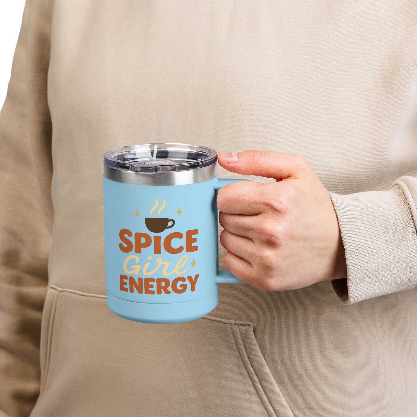 Person holding light blue “Spice Girl Energy” insulated mug — stylish and durable pastel mug for cozy coffee moments.