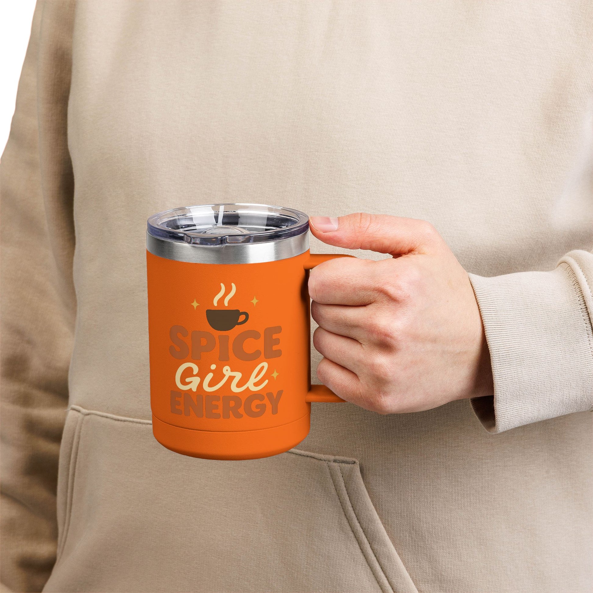 Person holding orange “Spice Girl Energy” insulated mug — stylish stainless steel coffee cup perfect for fall morning routines.