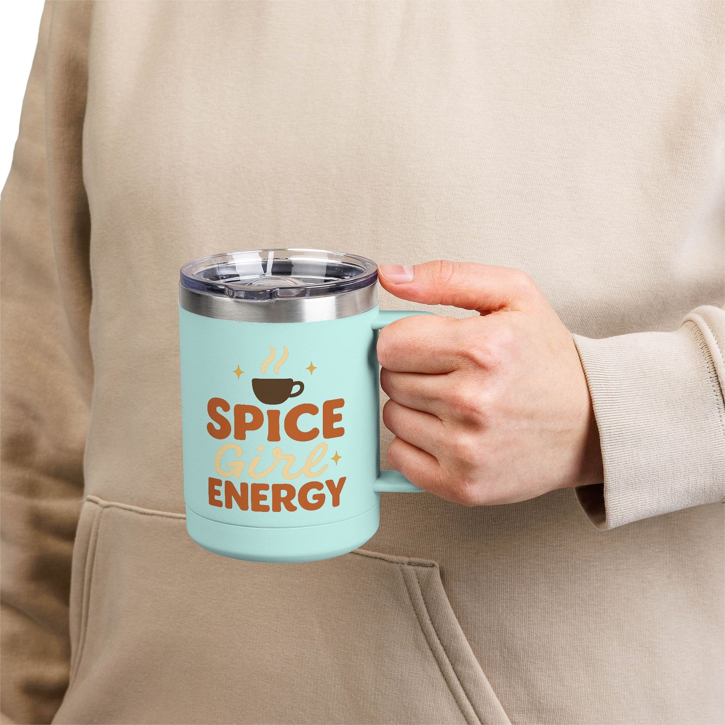 Person holding teal “Spice Girl Energy” insulated mug — pastel coffee mug for cozy fall mornings and pumpkin spice lovers.