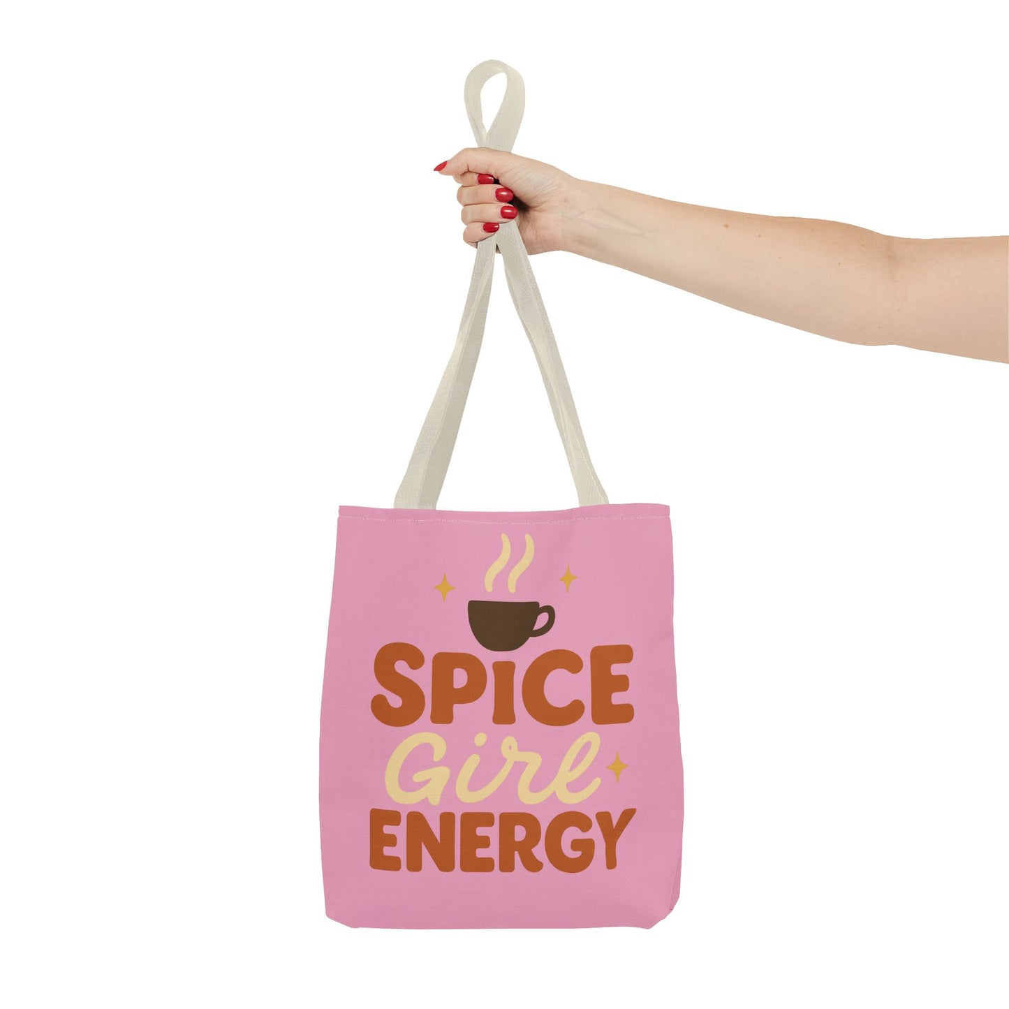 Beige-handled “Spice Girl Energy” tote bag held in hand — cute pink coffee-themed fall tote for everyday errands and cozy autumn vibes.