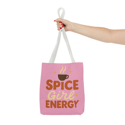 White-handled “Spice Girl Energy” tote bag held in hand — chic pink tote bag with coffee design for cozy autumn vibes.
