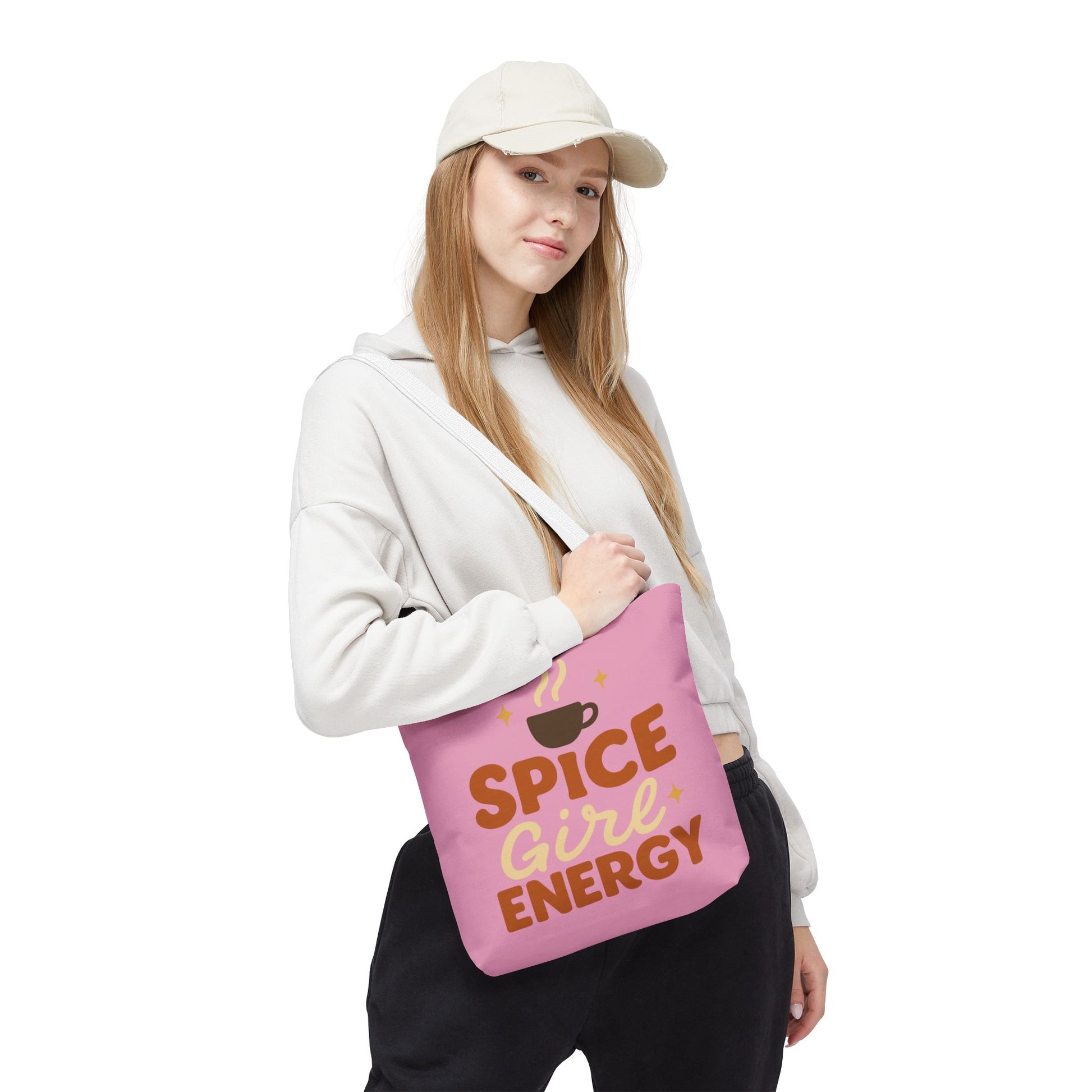 Model wearing “Spice Girl Energy” tote bag with white straps — fashionable pink tote for fall coffee lovers and everyday use.