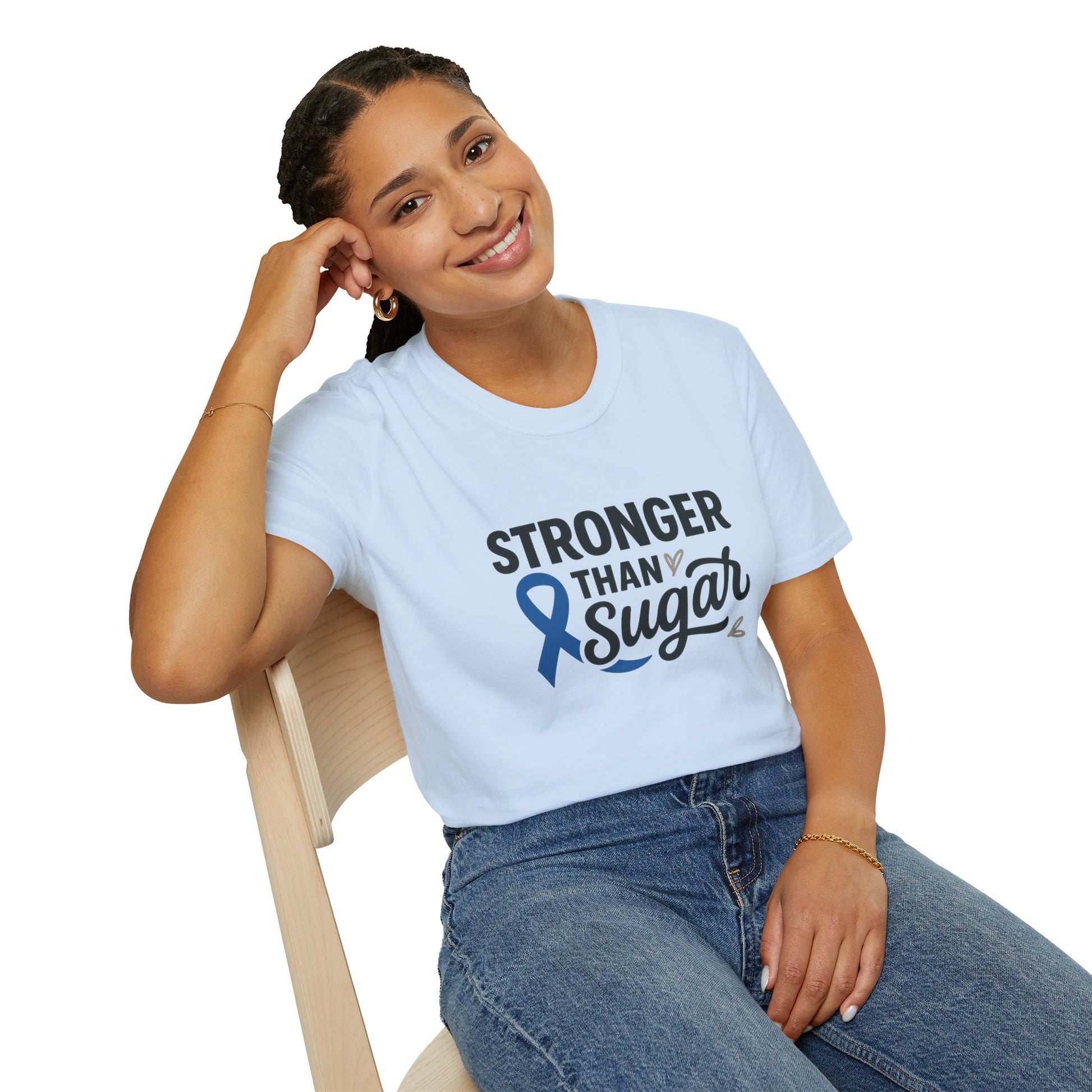 Smiling woman seated wearing Light Blue Stronger Than Sugar t-shirt — comfortable awareness apparel celebrating hope and health empowerment.