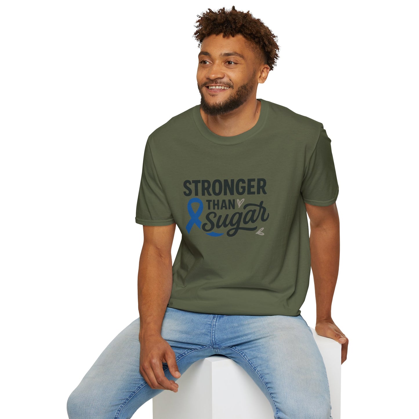 Man seated wearing Military Green Stronger Than Sugar t-shirt — soft cotton-blend awareness tee for diabetes warriors and supporters alike.