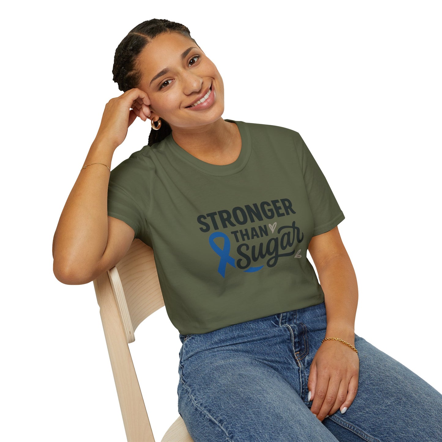 Smiling woman seated wearing Military Green Stronger Than Sugar t-shirt — comfortable awareness apparel celebrating hope and health empowerment.
