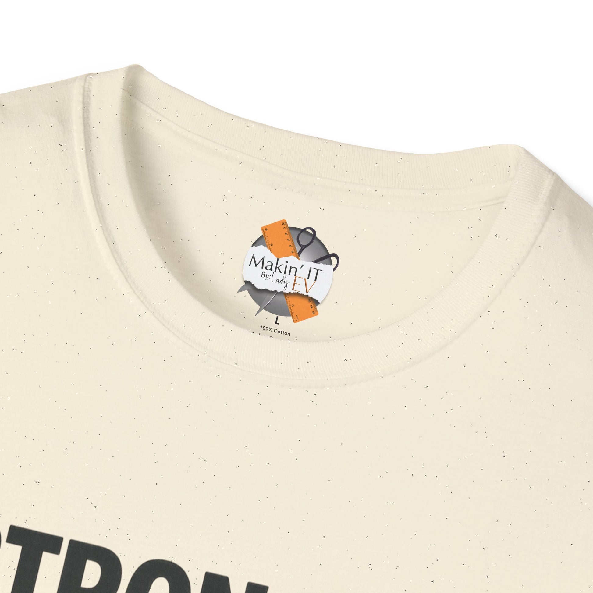 Close-up of Makin’ It By Lady Ev neck label inside Natural Stronger Than Sugar t-shirt — premium cotton-blend awareness apparel featuring brand logo.